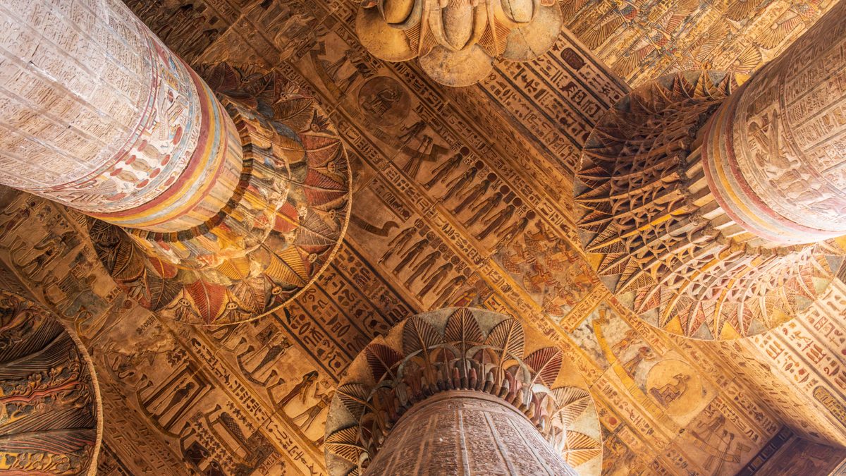 The painted ceiling of a temple, held by great columns