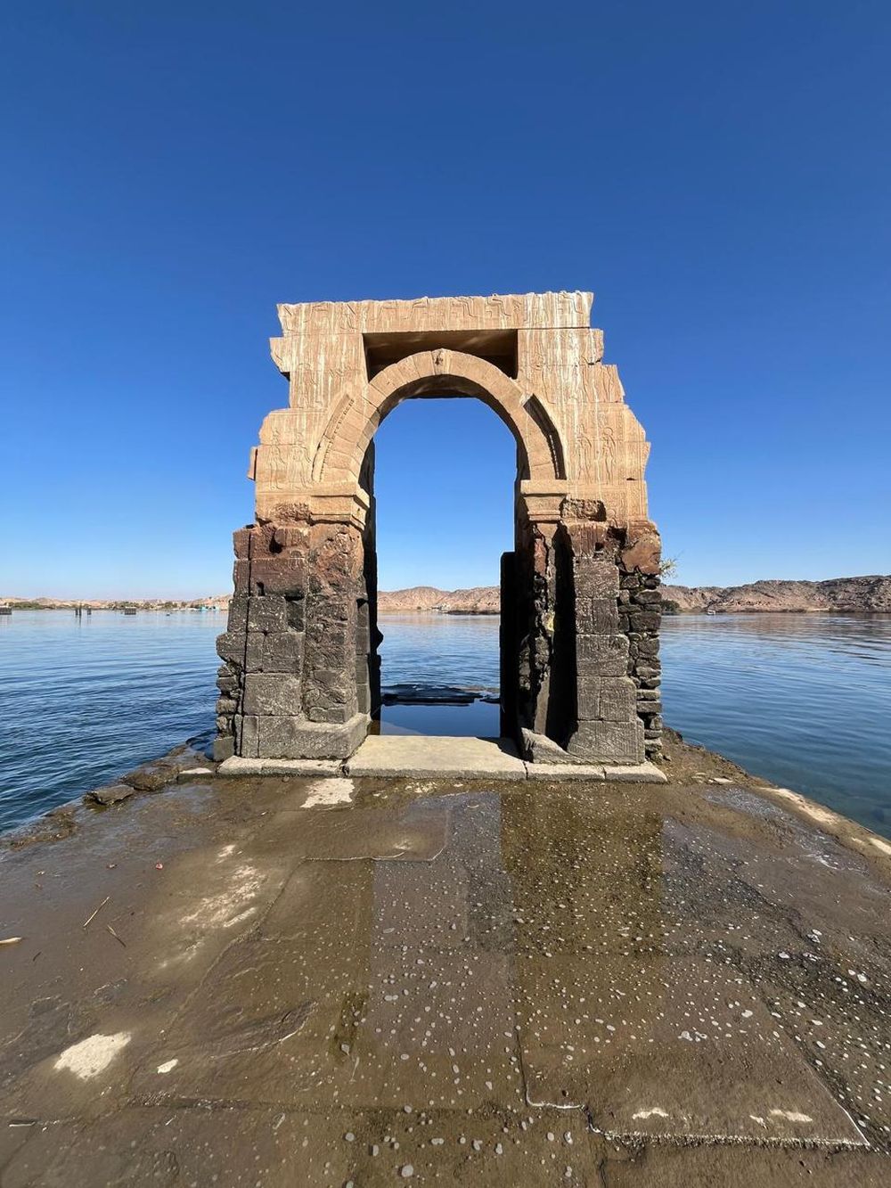 An ancient gateway standing in the water